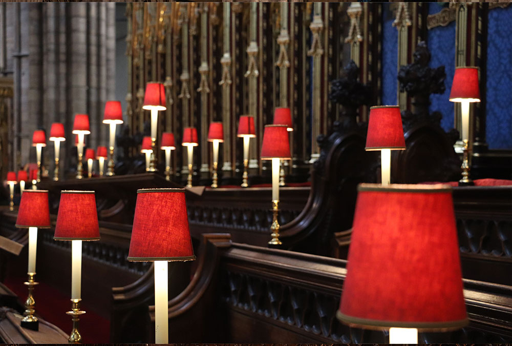 row-of-red-candles-in-the-interior-of-westminster-2023-11-27-05-18-47-utc